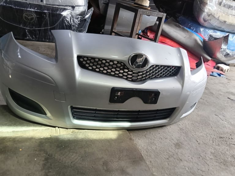 Bumper Toyota Vitz 5211952410