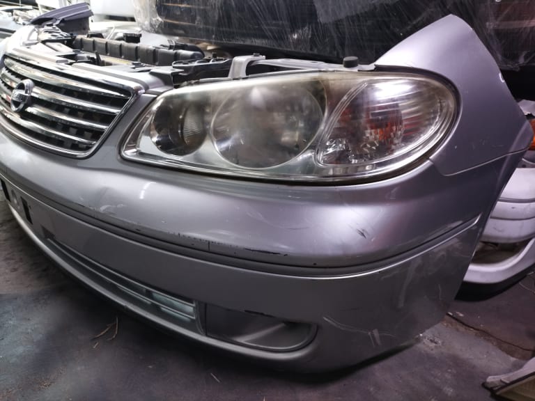 Bumper + Grille + Headlights Nissan Sunny used in Sharjah — photo 6