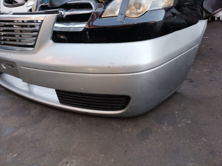 Bumper + Grille + Headlights Nissan Sunny used in Sharjah — photo 2