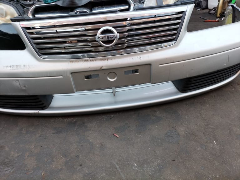 Bumper + Grille + Headlights Nissan Sunny used in Sharjah — photo 19