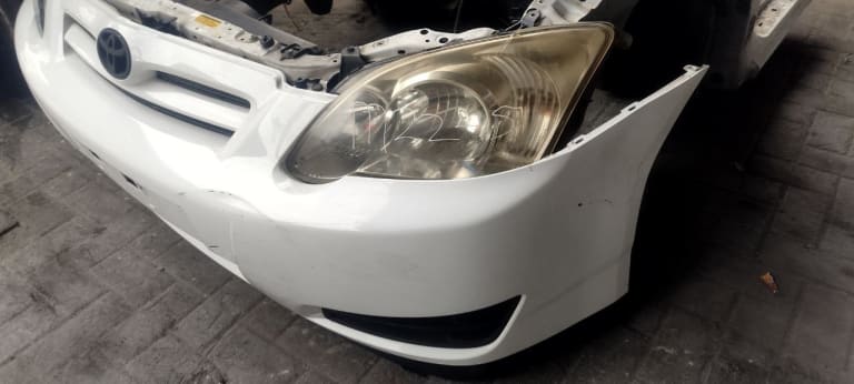 Bumper + Grille + Headlights Toyota Corolla Runx used in Sharjah — photo 2