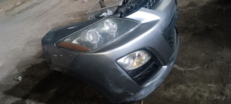 Bumper + Grille + Headlights Mazda CX-7 used in Sharjah — photo 6