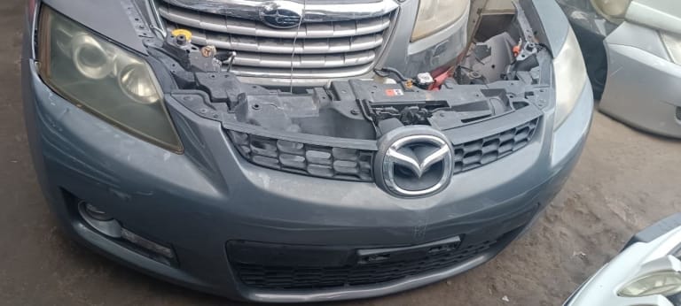 Mazda CX-7 Бампер передний с решеткой, фары 2шт 
