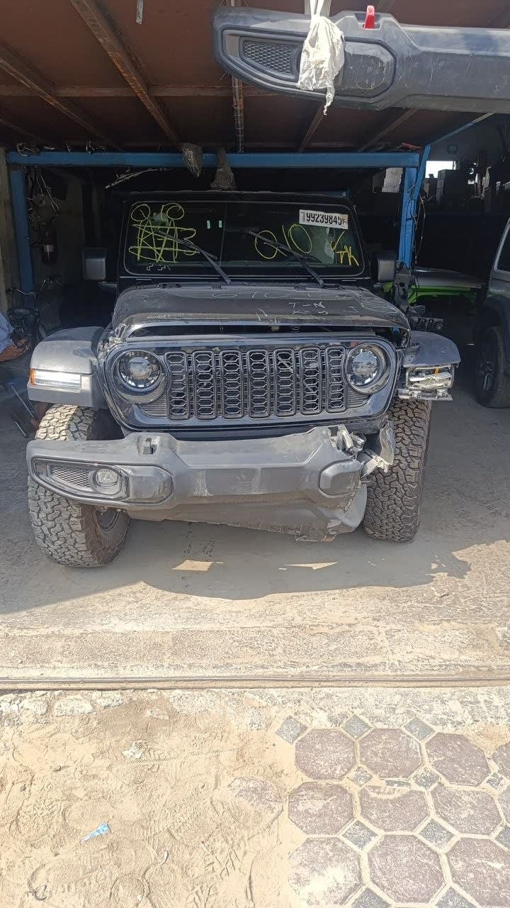 Grey Jeep Wrangler front halfcut — grille, headlights and bumper, Sharjah market