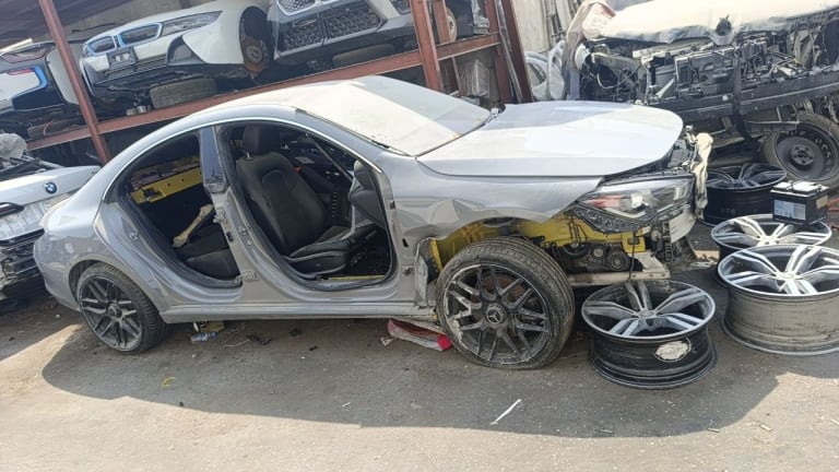 Silver Mercedes-Benz CLA halfcut — exposed engine bay, interior seats and alloy wheels, Sharjah market