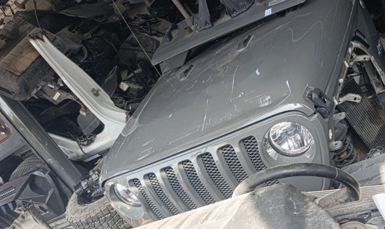 Dark grey Jeep Wrangler front halfcut — grille, round headlights and hood, Sharjah market