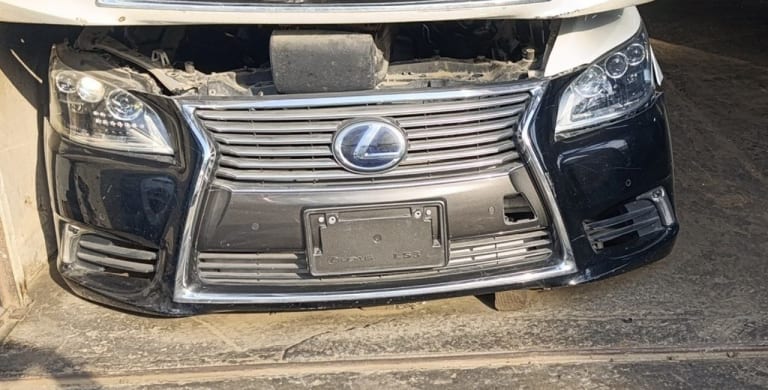 Black Lexus LS sedan front halfcut — spindle grille, headlights and bumper, Sharjah market