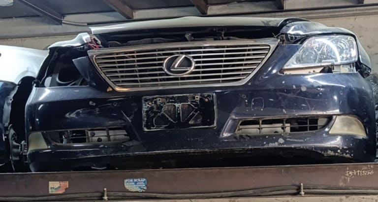 Dark blue Lexus LS460 sedan front halfcut — bumper, chrome grille and headlight, Sharjah market