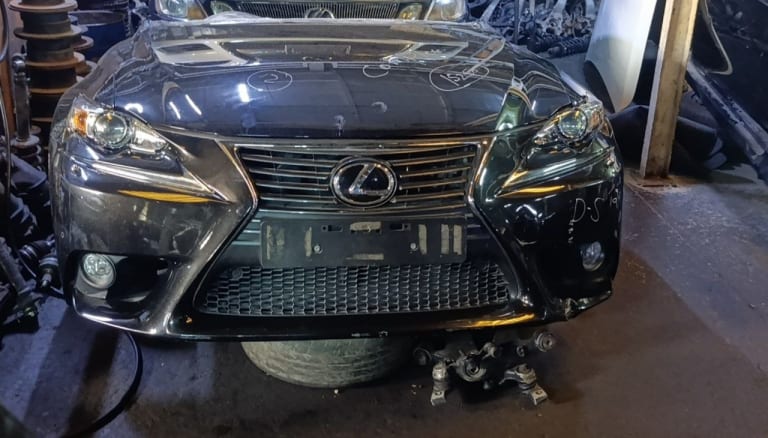 Dark grey Lexus IS front halfcut — spindle grille, projector headlights and front bumper, Sharjah market
