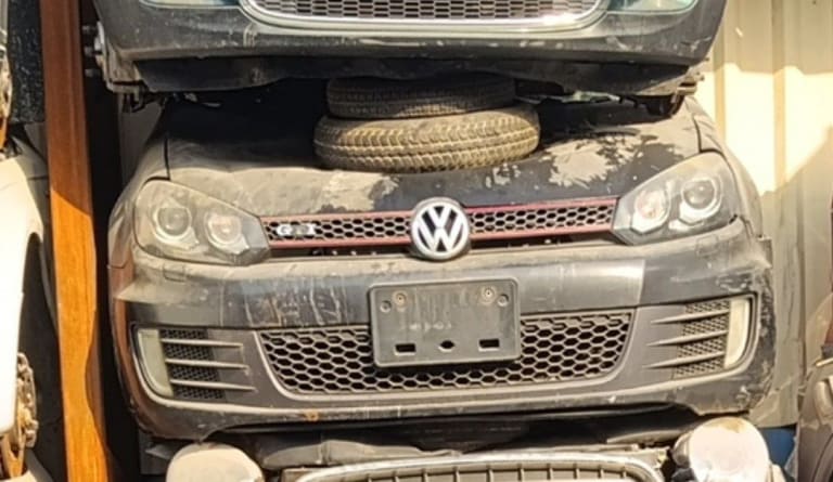 Dark grey Volkswagen Golf GTI front cut — GTI grille, headlights and bumper, Sharjah market