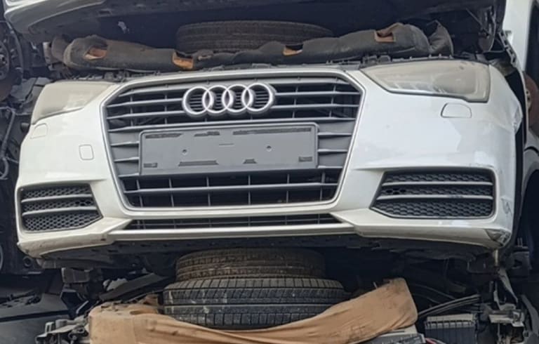 White Audi A3 front halfcut — bumper, single-frame grille and headlight, Sharjah market