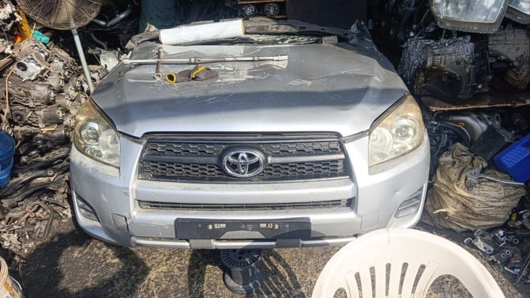 Silver Toyota RAV4 SUV front halfcut — bumper, grille, headlights and hood, Sharjah market