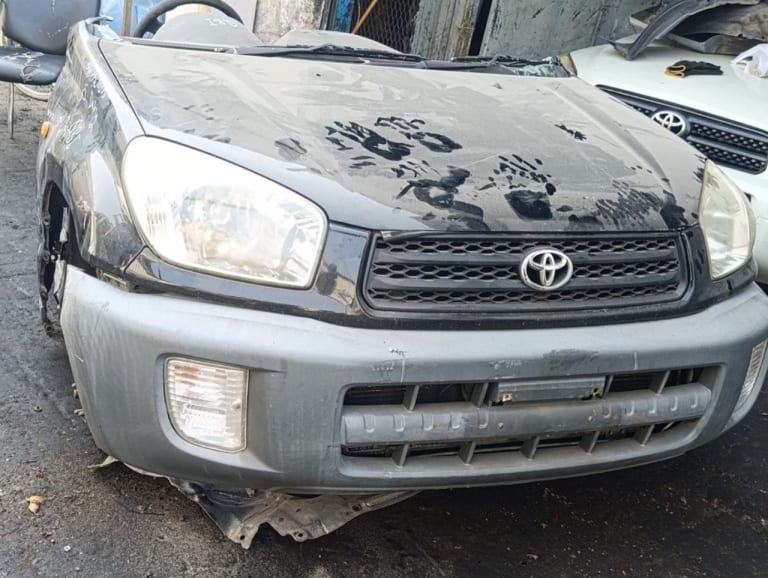 Black Toyota RAV4 SUV front cut — hood, grille, headlights and bumper, Sharjah market