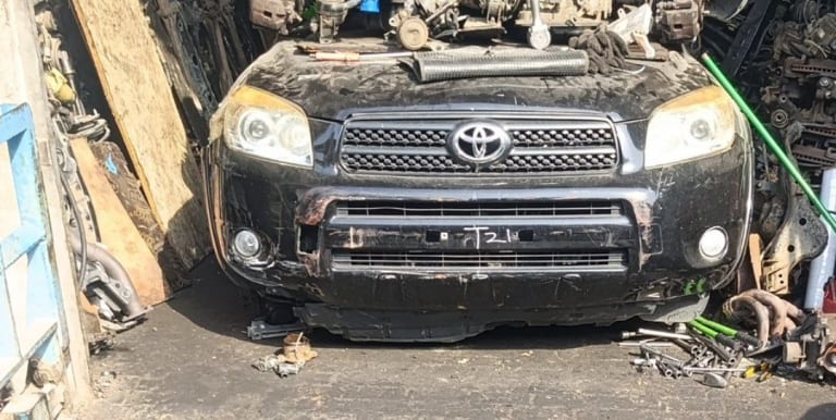 Black Toyota RAV4 front halfcut — bumper, grille, headlights and hood, Sharjah market