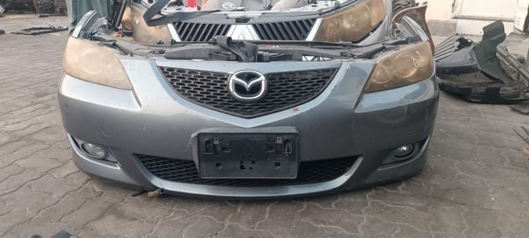 Bumper + Grille Mazda Mazda3 FNKB19090C