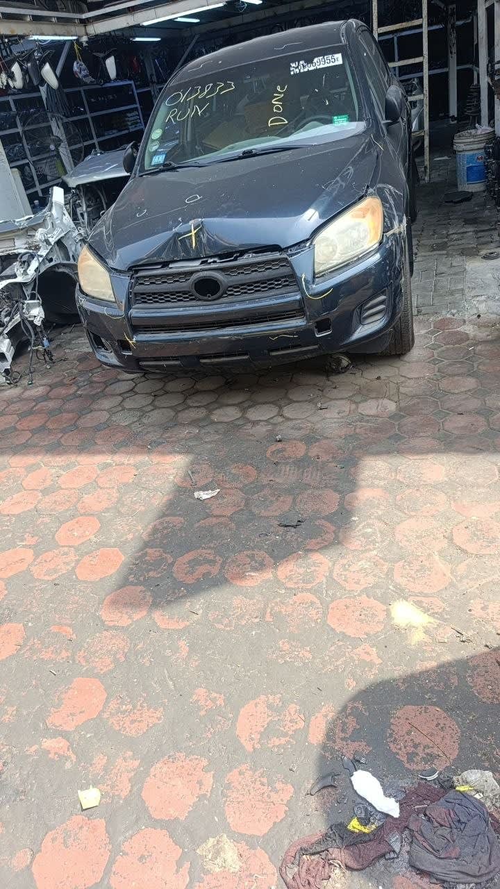 Dark blue Toyota RAV4 SUV front end for parts — bumper, grille, headlights and hood, Sharjah market