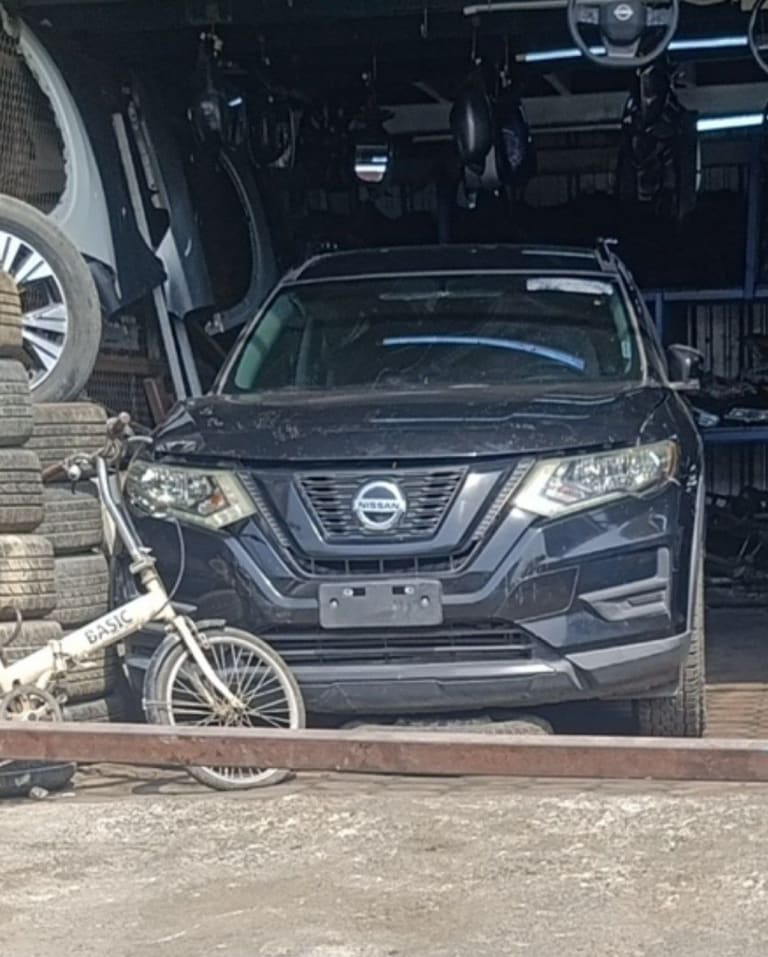 Dark blue Nissan X-Trail / Rogue SUV front — grille, headlights, bumper and hood, Sharjah market
