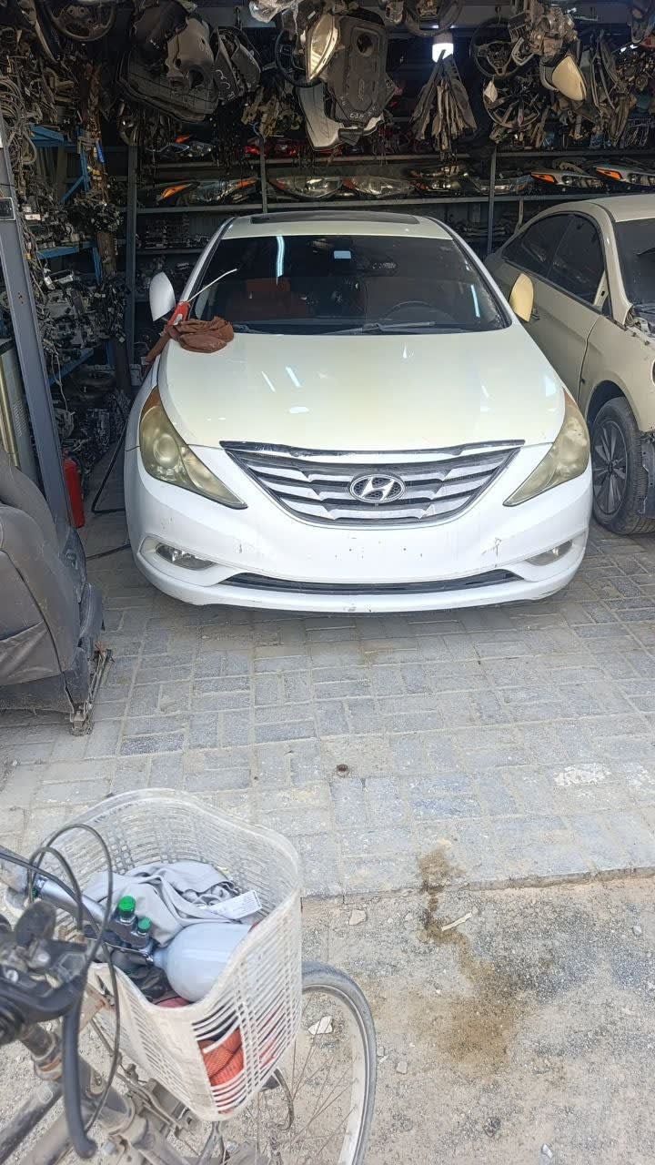White Hyundai Sonata sedan front — bumper, grille, headlights and hood, Sharjah market