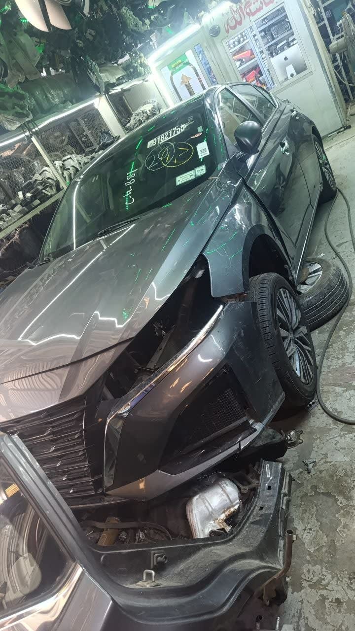 Dark grey Lexus RX halfcut front cut — hood, grille, fender and alloy wheel, Sharjah market