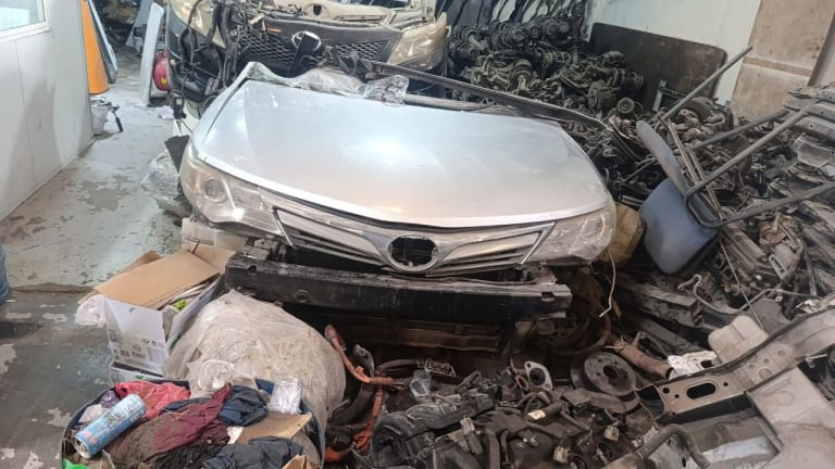 Silver Toyota Camry sedan front halfcut — hood, grille, headlights and radiator support, Sharjah market