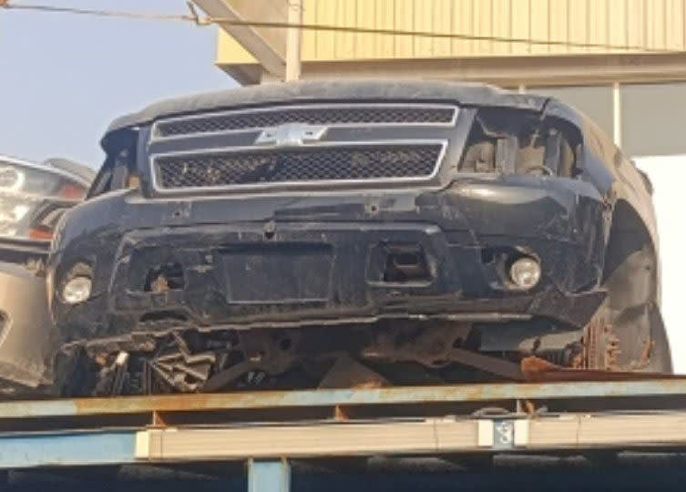 Black Chevrolet Tahoe SUV front halfcut — grille, bumper and headlights, Sharjah market