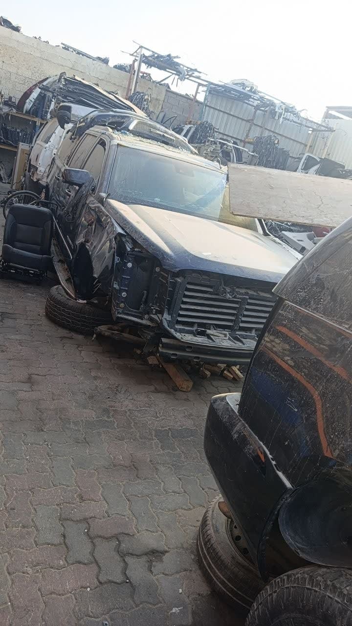 Dark blue Cadillac Escalade halfcut — grille, radiator support and hood, Sharjah market