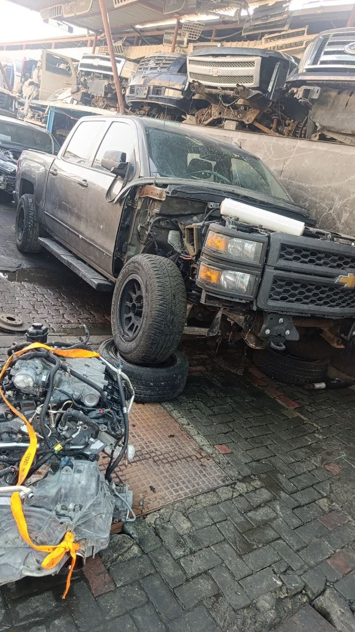 Dark grey Chevrolet Silverado 1500 crew cab halfcut — grille, headlight, doors and engine, Sharjah market