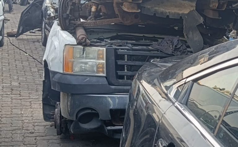 White GMC Sierra front halfcut — headlight, grille and front bumper, Sharjah market