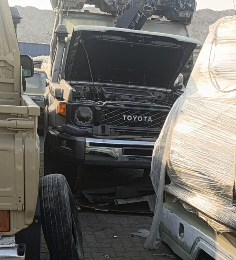 Dark grey Toyota Land Cruiser 70 Series front cut — bumper, grille, headlight and open hood, Sharjah market