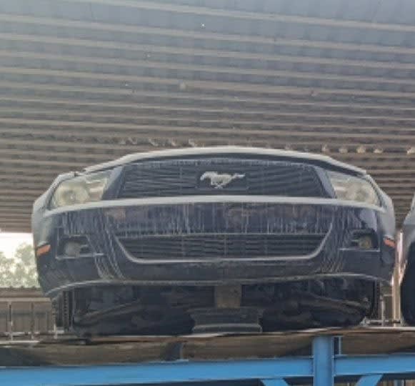 Dark blue Ford Mustang coupe front halfcut — bumper, pony grille and headlights, Sharjah market