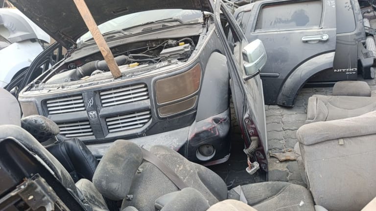 Dark grey Dodge Nitro SUV halfcut — grille, headlights, hood and front bumper, Sharjah market