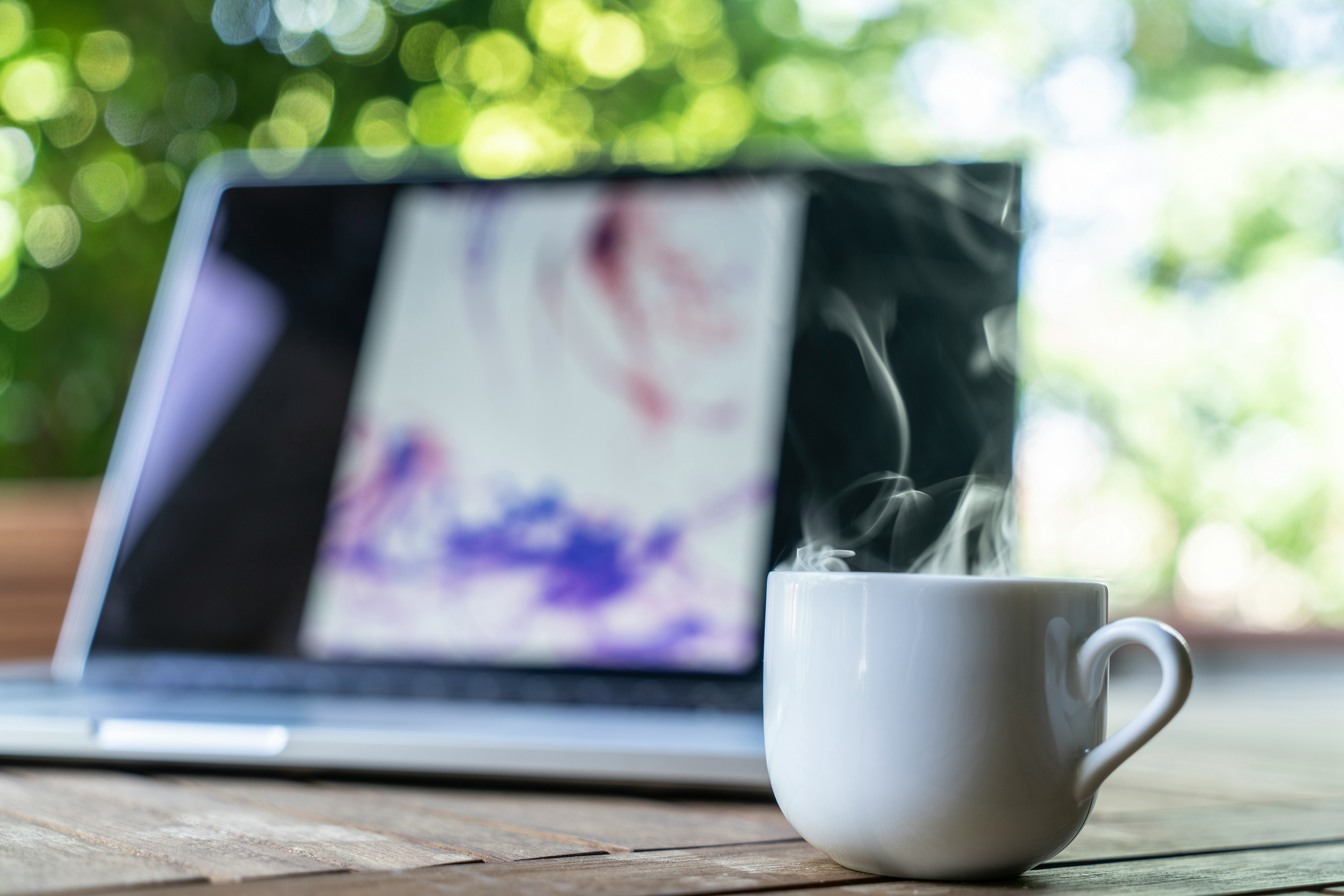 Photo by https://unsplash.com/@Shallow focus photography of white ceramic mug near laptop by ale s bianchi