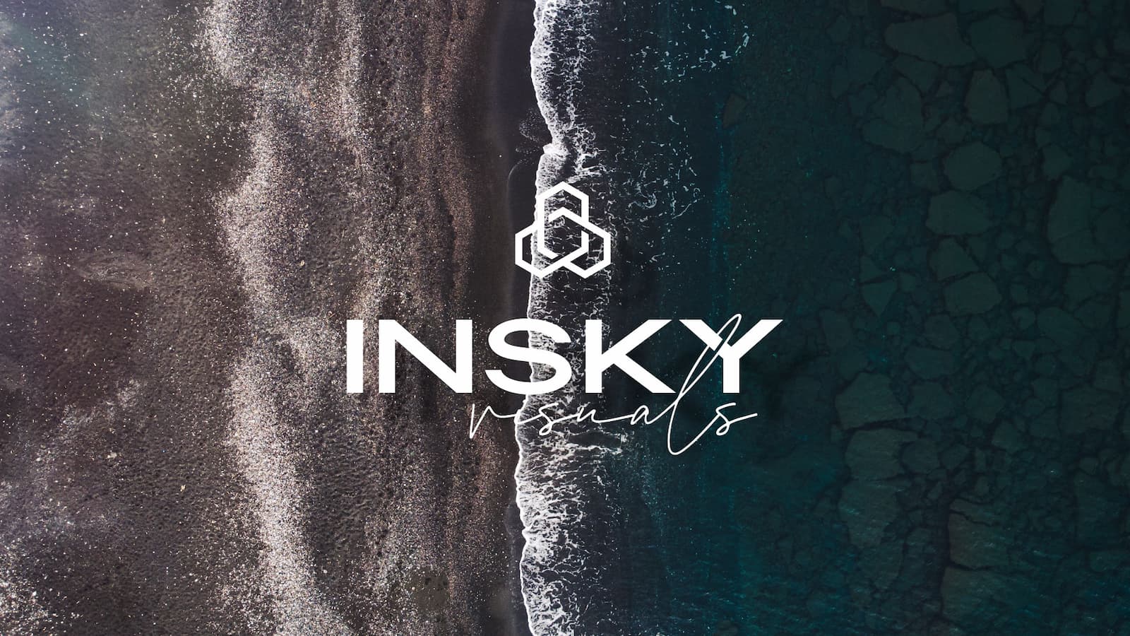 Aerial shot of the Insky Visuals logo casting a shadow over breaking waves