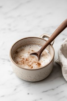 Rustic Ceramic Bowl with Wooden Spoon