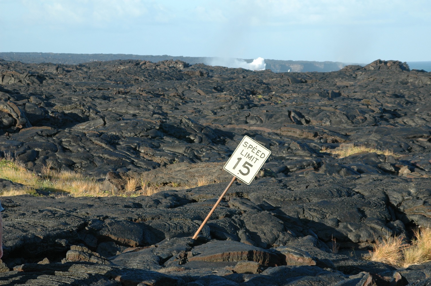 lava field covers road sign