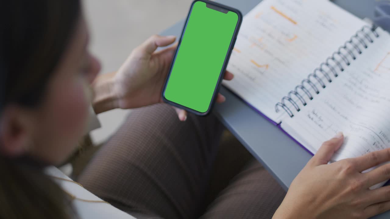 Business Woman Holdinga Cell Phone with Green Screen preview