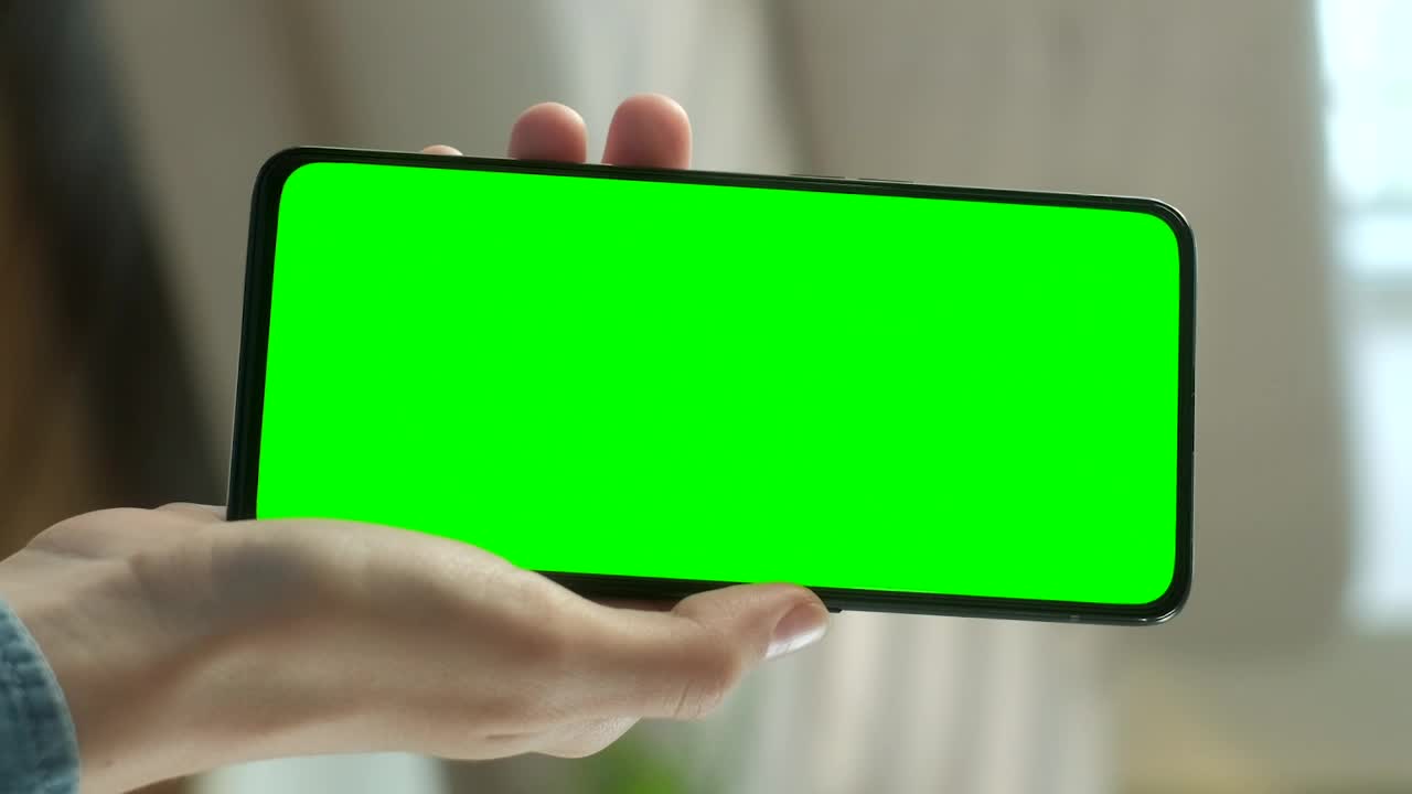 Hand Showing a Sell Phone with Green Screen preview