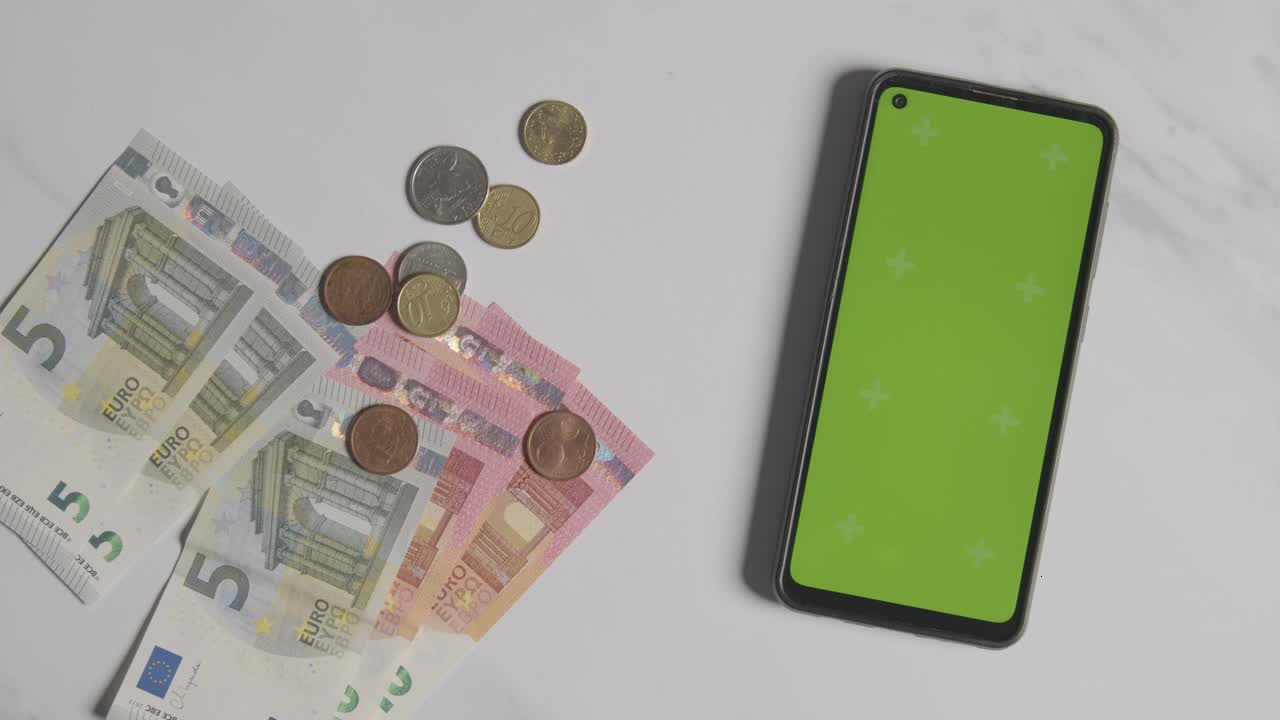 Woman Picking Up Cash and Phone with Green Screen Video preview