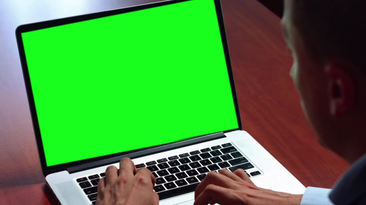 Young Man Working on Laptop Free Green Screen preview
