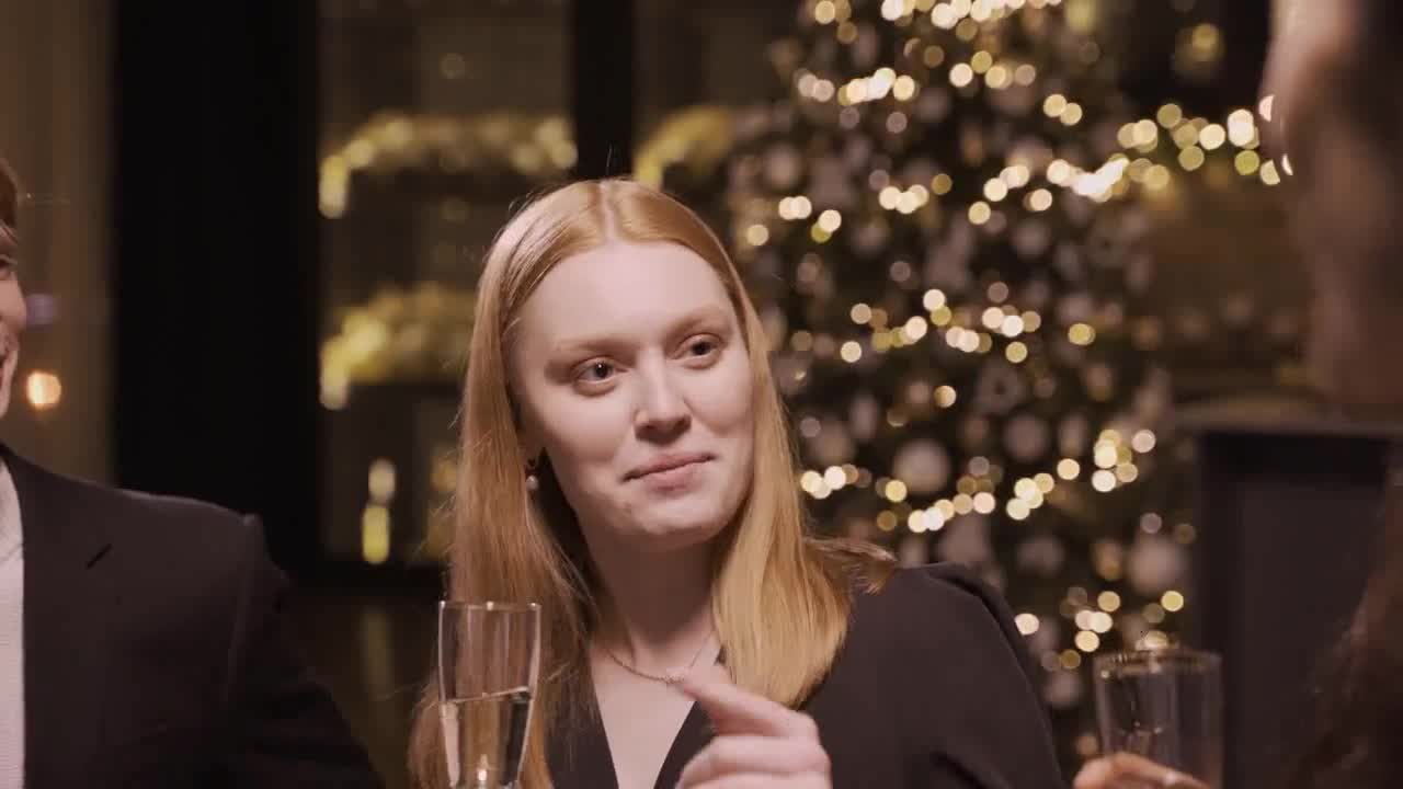 Camera focus on girl talking with friends preview