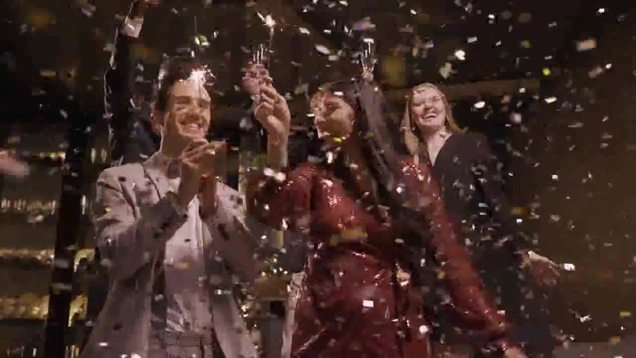 Couple dance and kissing in confetti preview