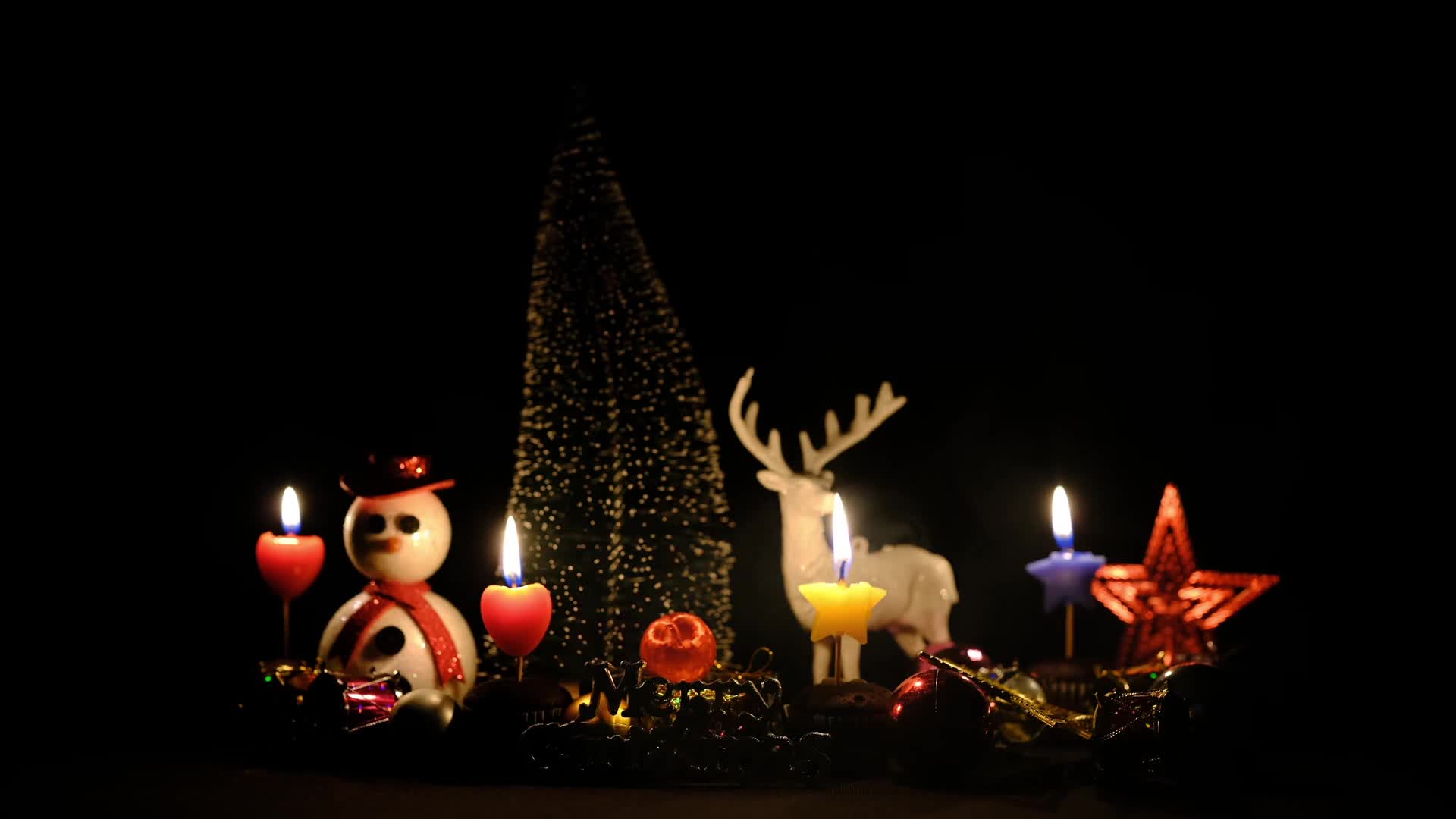 Beautiful scene of candles around christmas toys preview