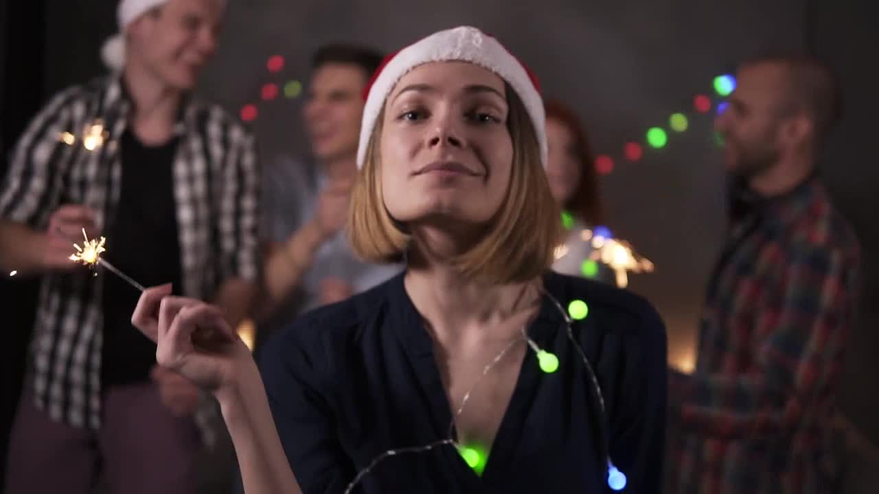 Friends dance on new year eve with sparklers preview