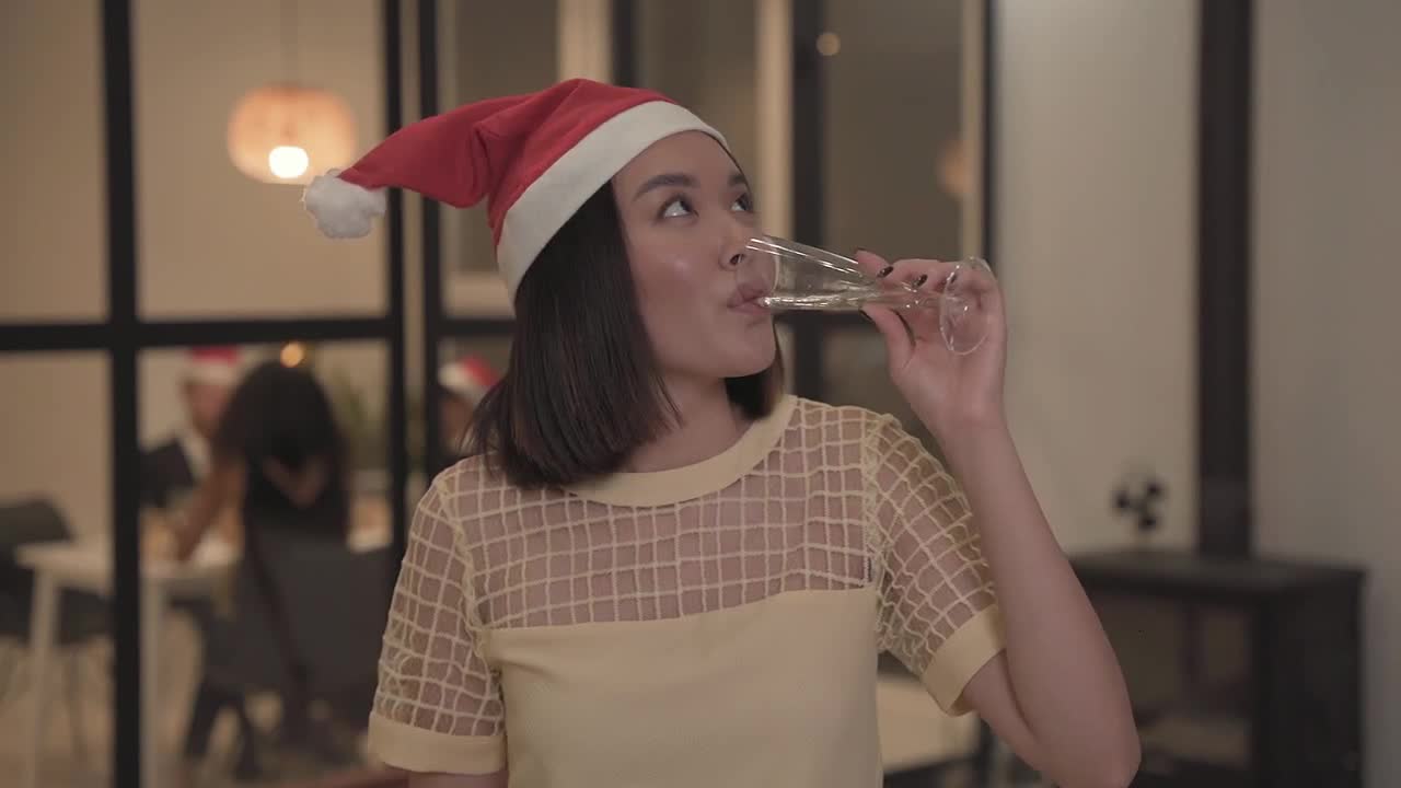 Girl show their champagne glass in christmas party night preview
