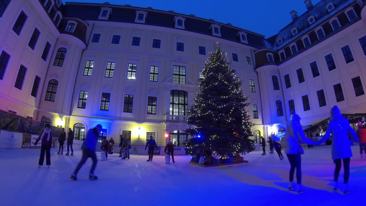 People skating in late evening on christmas night preview