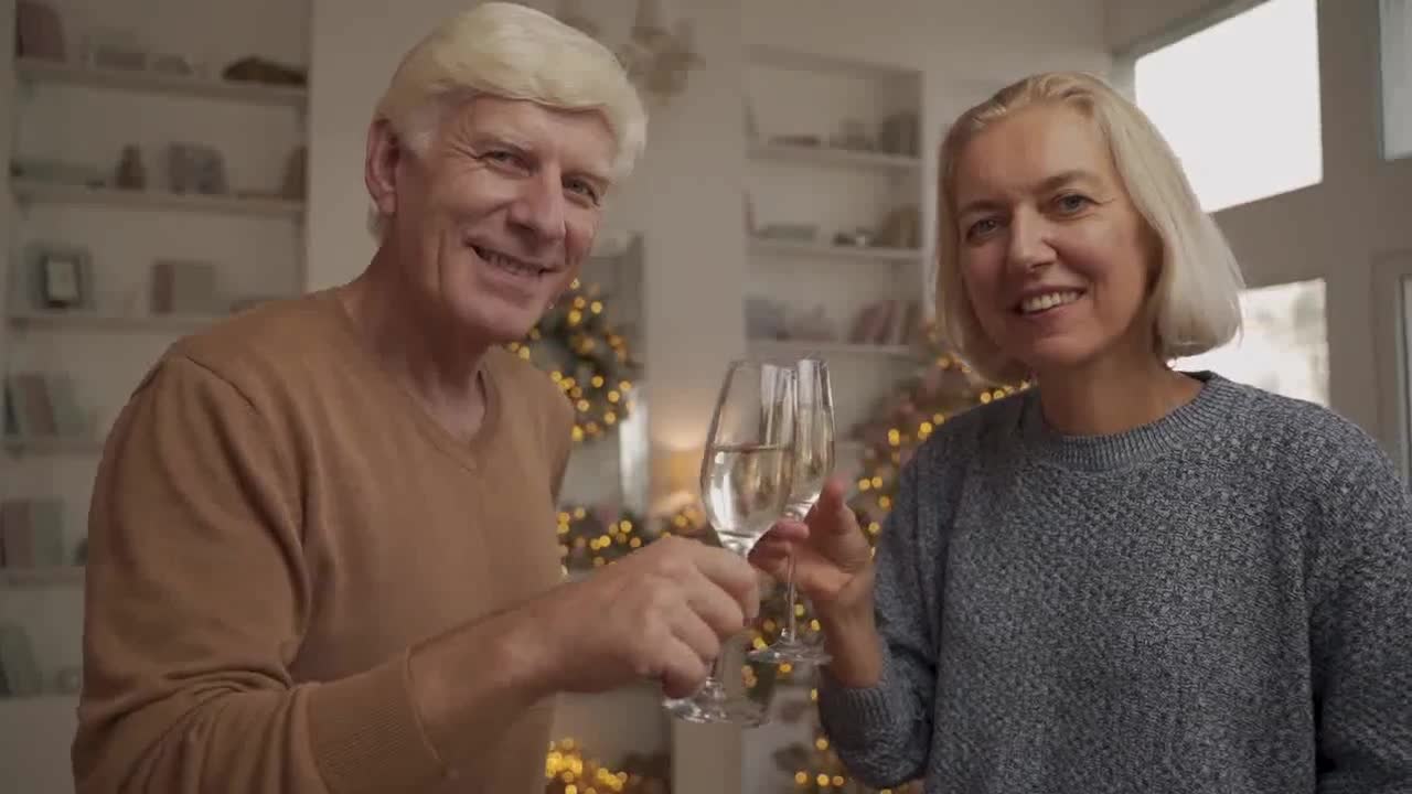 Stock footage of old pair dressed in elegant clothes toast with a glass of champagne preview