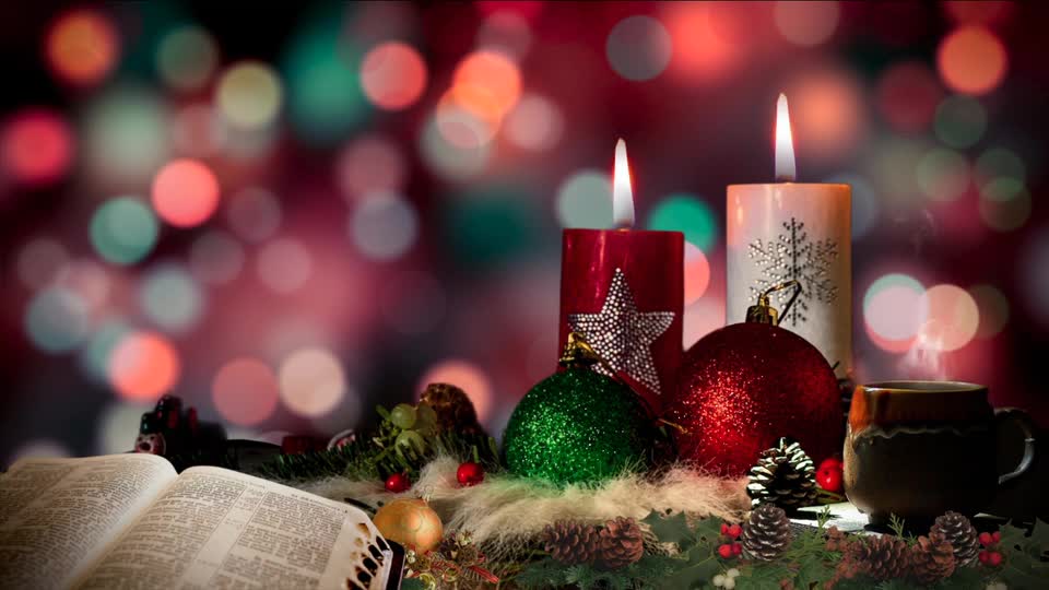 Stock footage of religious book with candles preview