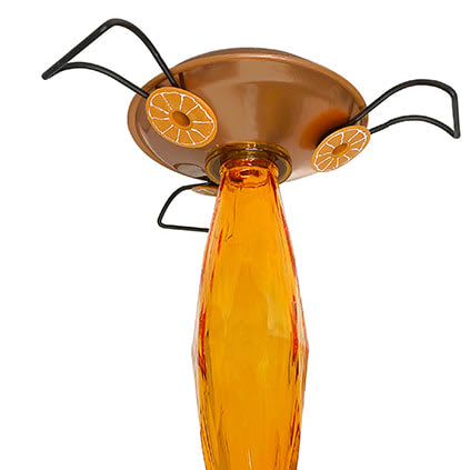 Close up of glass in base of oriole feeder