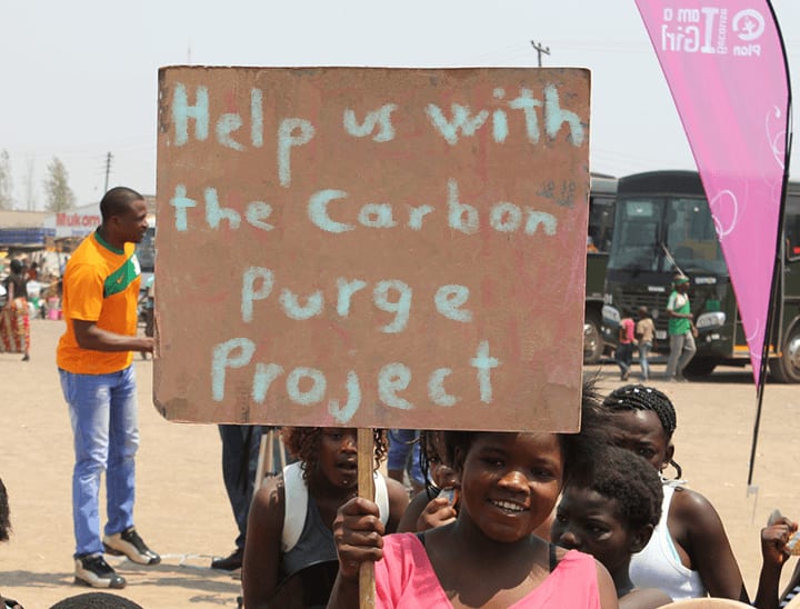 African Children Holding Carbon Purge Sign