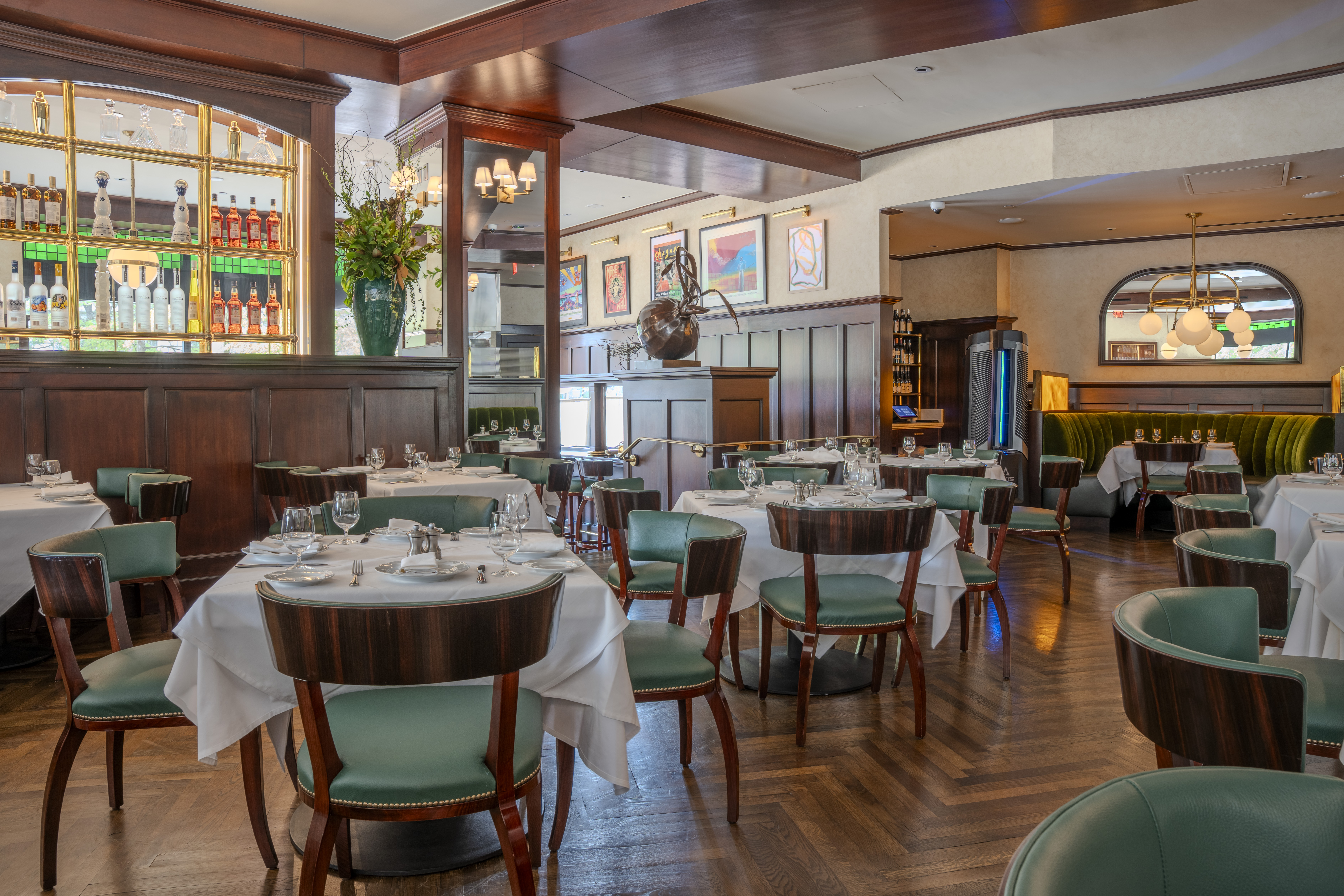 Main dining area featuring restored wood floors at Café Fiorello DC — commercial interior photography by GZ Productions